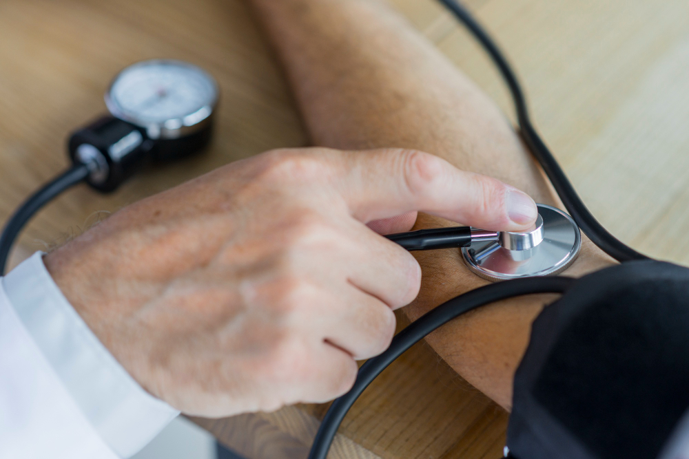 close up of a patient blood pressure being taken by a primary care physician